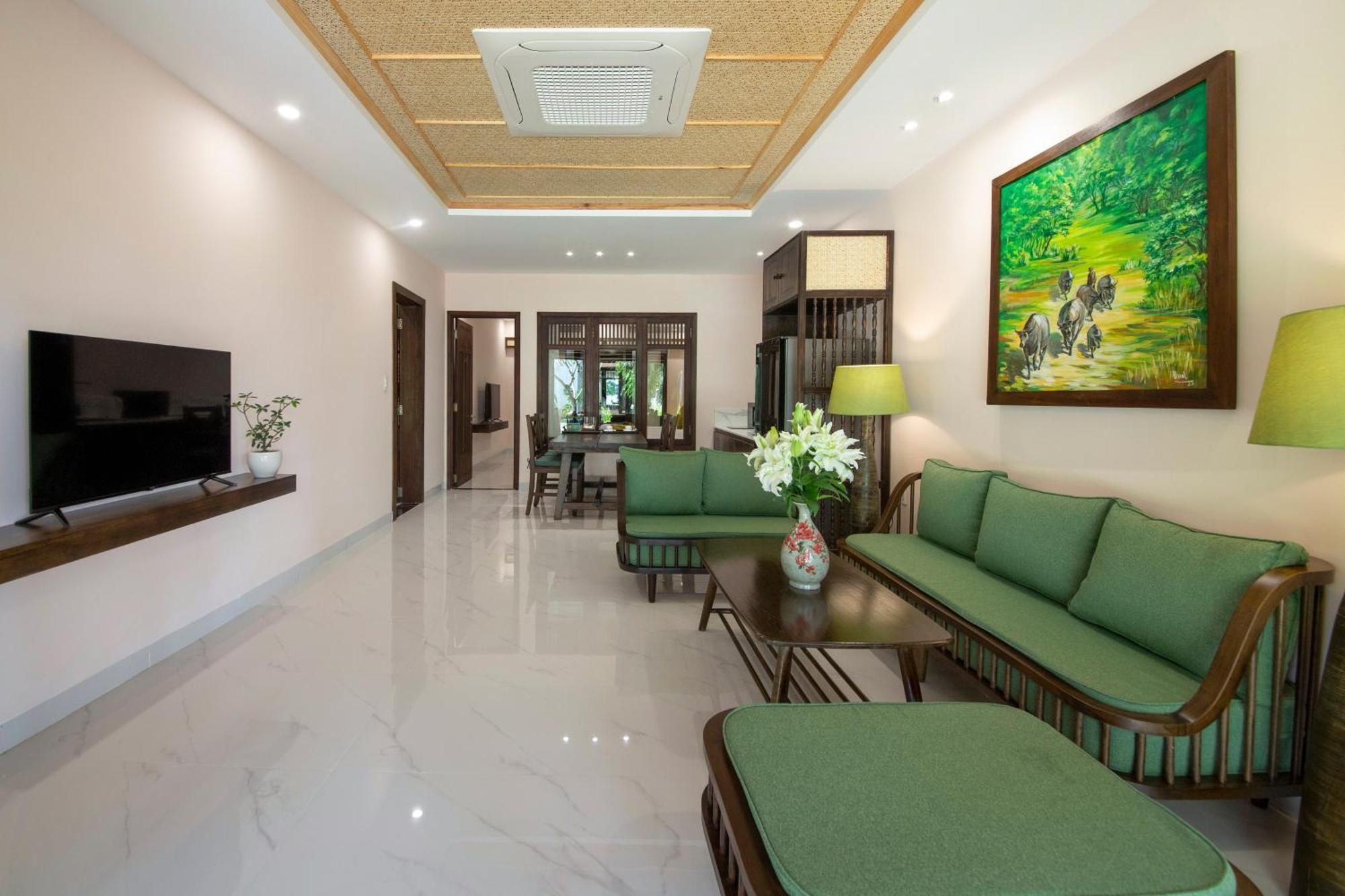 Palm Garden Beach Resort & Spa Hoi An Exterior foto Interior of a suite at the hotel